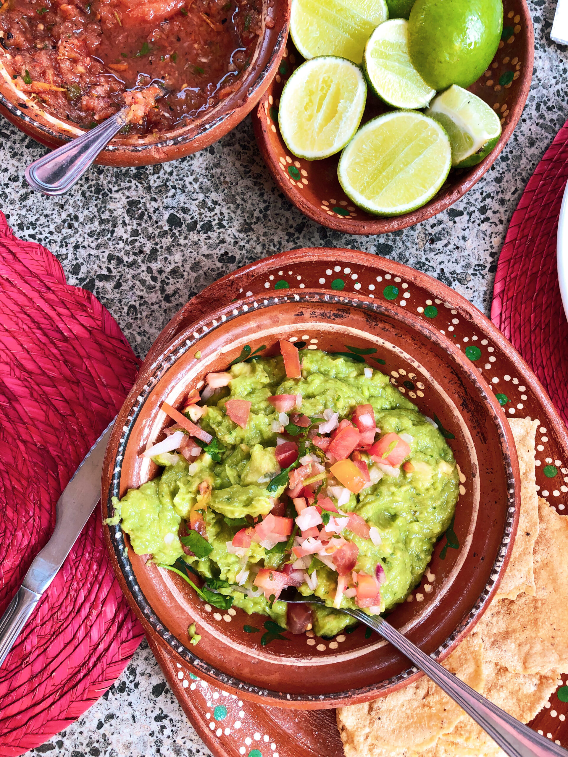 image of guacamole, salsa and limes at a restaurant in Tequila